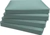 A stack of four teal-colored cushions on a white background. Produktbild-Vorschau