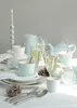 A table setting with tableware, drinks, and festive decorations. Produktbild-Vorschau