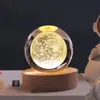 A crystal ball lamp with a moon design on a wooden base. Náhled obrázku produktu