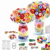 A DIY craft kit for making button flowers and decorating vases, displayed with all its components. Produktbild-Vorschau