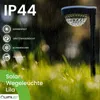 A solar garden light in a grassy area during rain, with text overlays highlighting its features. Náhľad obrázku produktu