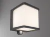 A modern, gray outdoor wall light with a frosted white diffuser is mounted on a gray wall. Anteprima dell’immagine prodotto