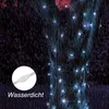 A string of white LED lights wrapped around a tree trunk in the rain. Produktbild-Vorschau