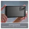 Hands holding a black phone case with a brushed texture and carbon fiber accents. Produktbild-Vorschau