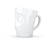 A white ceramic mug with a face design. Náhľad obrázku produktu