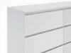 A close-up view of a white dresser with multiple drawers. Produktbild-Vorschau
