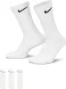 A pair of white Nike crew socks with black Nike logos, and three more pairs of socks shown below. Produktbild-Vorschau