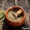 A close-up shot of a bowl filled with grains, a wooden scoop inside, and wheat stalks to the side, all on a rustic wooden surface. Náhľad obrázku produktu