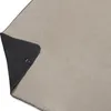 A close-up view of a folded blanket, showing two different colored sides. Produktbild-Vorschau
