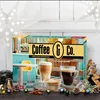 A coffee advent calendar with coffee cups in the foreground, set against a festive, star-decorated background. Produktbild-Vorschau