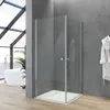 A modern bathroom with a glass shower enclosure, a white bathtub, and a large window. Produktbild-Vorschau