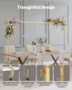 A decorative archway with floral arrangements is set up over a dining table. Voir les images du produit