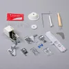A collection of sewing machine accessories laid out on a gray surface. Anteprima dell’immagine prodotto