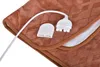 A close-up view of a brown heated blanket with its power cord and connector. Produktbild-Vorschau