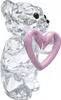 A clear, professional studio shot of a crystal bear figurine holding a pink heart. Produktbild-Vorschau