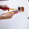 Two hands are using electrical testers on an open electrical outlet in a textured wall. Náhľad obrázku produktu