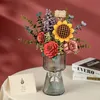 A 3D wooden flower bouquet in a glass vase, placed on a table with a thank you card and books in the background. Produktbild-Vorschau