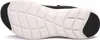 The underside of a black and white sneaker is shown against a white background. Voir les images du produit