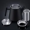 A black and silver teapot set is displayed against a dark background. Produktbild-Vorschau