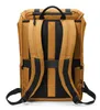 The back view of a brown backpack with black straps and padding. Náhled obrázku produktu