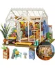 A miniature greenhouse model with furniture and plants. Podgląd zdjęcia produktu