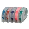 A set of five different colored label tapes in clear plastic holders, arranged in a row. Voir les images du produit