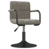 A studio shot of a single gray velvet armchair with a black base and armrests. Anteprima dell’immagine prodotto