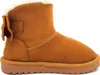 A single brown boot with a white fluffy lining and a bow on the side, presented against a white background. Produktbild-Vorschau