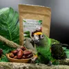 A parrot is shown next to a bowl of dates and a bag of parrot food. Voir les images du produit