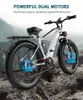 An electric mountain bike is shown in a natural outdoor setting with rocky terrain. Podgląd zdjęcia produktu