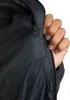 Close-up of a person's hand zipping up a black jacket. Produktbild-Vorschau