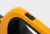 A close-up shot of a yellow and black switch on a tool handle. Produktbild-Vorschau