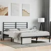A bedroom scene with a black metal bed frame and headboard. Náhled obrázku produktu