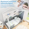A child sleeping in a bed with a house-shaped frame, decorated with string lights and a garland. Anteprima dell’immagine prodotto