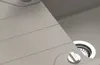 A close-up view of a sink with a drain and a control knob. Anteprima dell’immagine prodotto