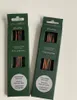 Two green cardboard boxes containing knitting needles. Produktbild-Vorschau
