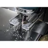 A jigsaw cutting through a metal surface, creating metal shavings. Voir les images du produit