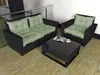 An outdoor furniture set with a sofa, armchair, and coffee table on a wooden deck. Produktbild-Vorschau
