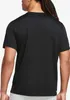 The back view of a person wearing a black t-shirt. Podgląd zdjęcia produktu