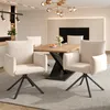 A dining room setting with a wooden table and chairs. Produktbild-Vorschau