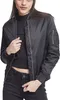 A woman wearing a black bomber jacket and black jeans. Produktbild-Vorschau