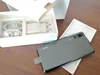 A Huawei P20 Pro smartphone is shown next to its packaging and accessories. Produktbild-Vorschau