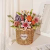 A 3D wooden flower bouquet in a woven basket, decorated with a heart-shaped "I love you" tag, placed on a table next to a small statue and a mirror. Podgląd zdjęcia produktu
