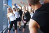 A group of people are stretching in a gym. Produktbild-Vorschau