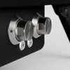 Close-up of two control knobs and two buttons on a black surface. Produktbild-Vorschau