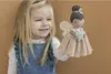 A young girl holding a doll. Náhled obrázku produktu