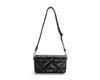 A black handbag with a quilted pattern and a shoulder strap, shown against a white background. Produktbild-Vorschau