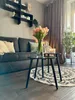 A living room scene with a sofa, coffee table, and decor. Produktbild-Vorschau