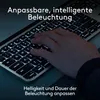 A hand typing on a backlit keyboard. Anteprima dell’immagine prodotto