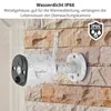 A white outdoor security camera is mounted on a stone wall, with water droplets on the camera and wall, indicating it is waterproof. Anteprima dell’immagine prodotto